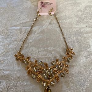Three- Tiered gold Necklace (costume with matching earrings 
With earrings